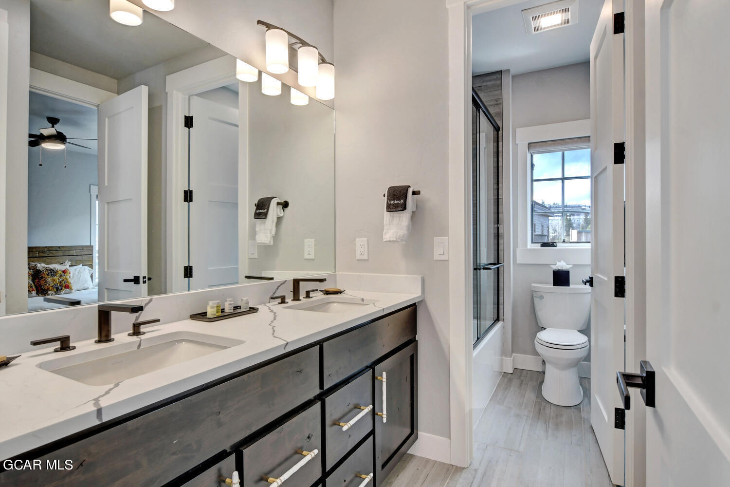 Undisclosed Address Winter Park, CO 80482 - Photo 22 of 52 a bathroom with a double vanity sink toilet and shower