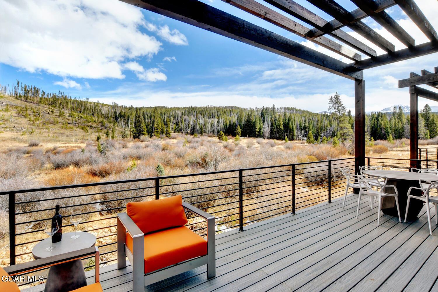 Undisclosed Address Winter Park, CO 80482 - Photo 38 of 52 a view of a balcony with wooden floor and outdoor seating