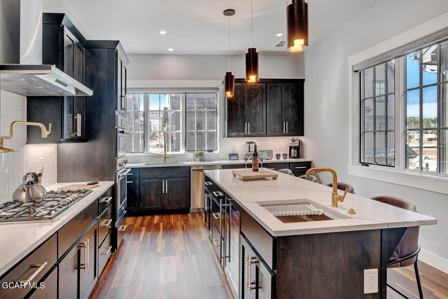 Undisclosed Address Winter Park, CO 80482 - Photo 10 of 52 a kitchen with stainless steel appliances granite countertop a sink stove and refrigerator