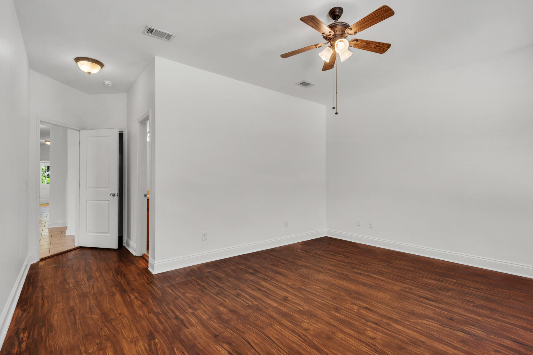 249 County Line Road Niceville, FL 32578 - Photo 13 of 17 a view of a room with wooden floor and a ceiling fan