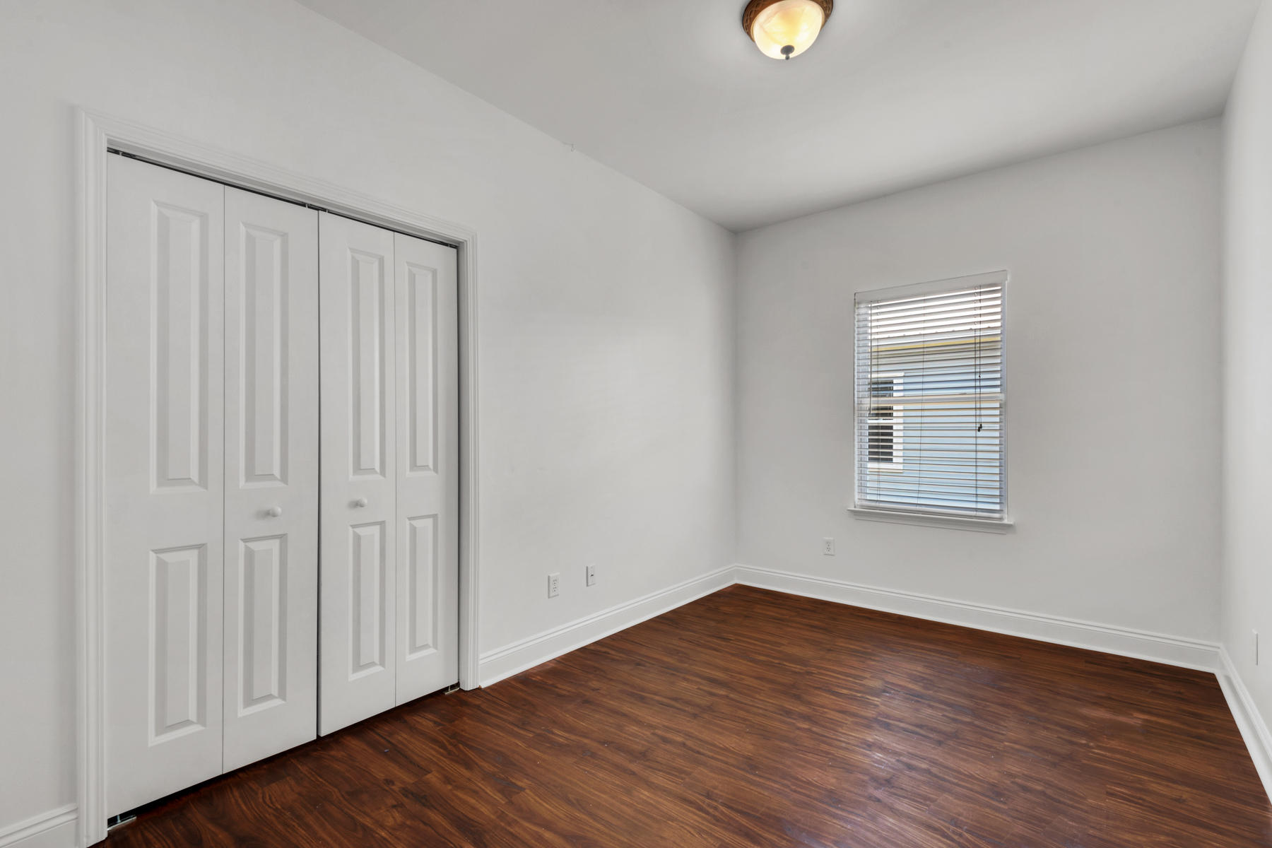 249 County Line Road Niceville, FL 32578 - Photo 14 of 17 a view of an empty room with wooden floor and a window