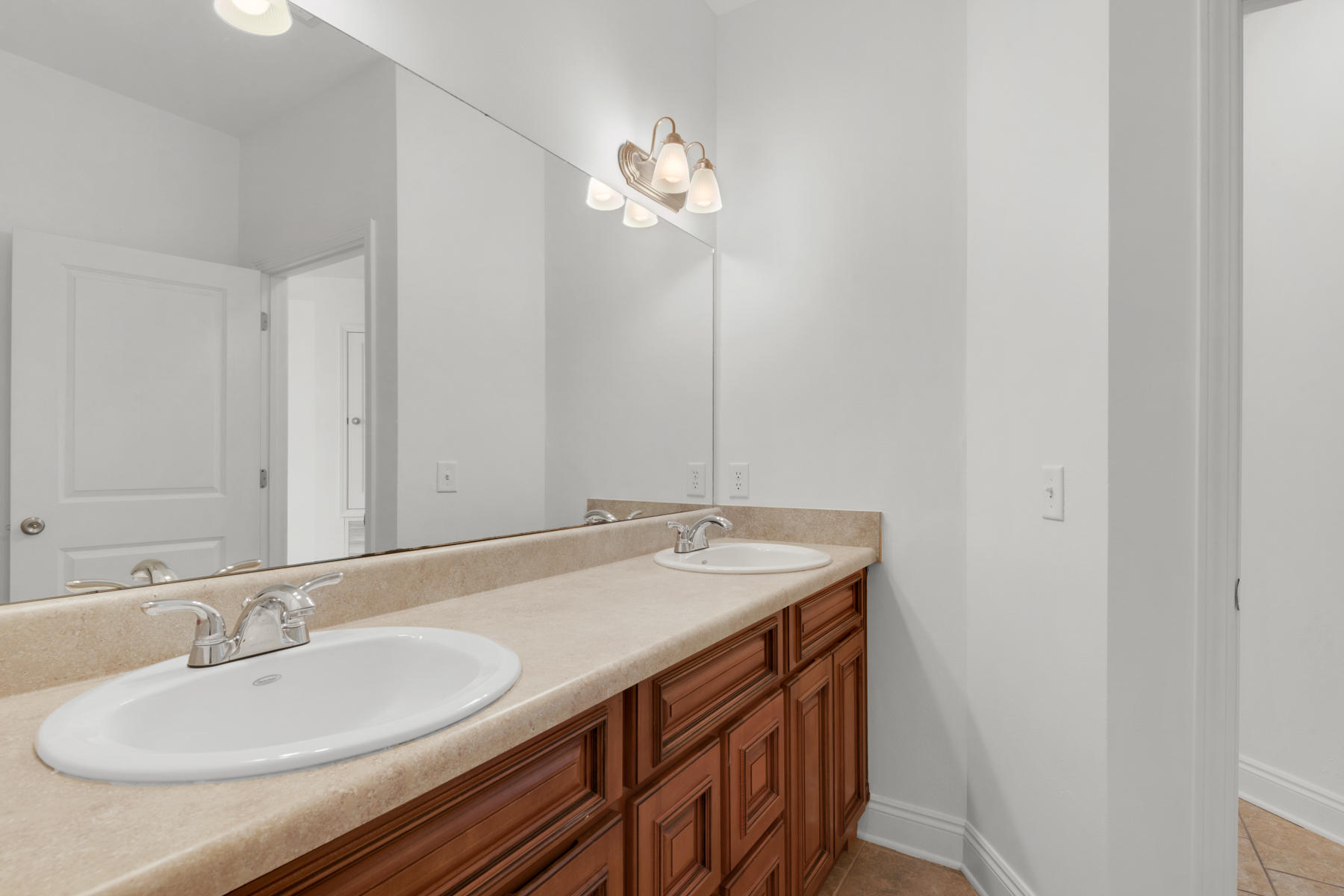 249 County Line Road Niceville, FL 32578 - Photo 16 of 17 a bathroom with a granite countertop sink a large mirror and vanity