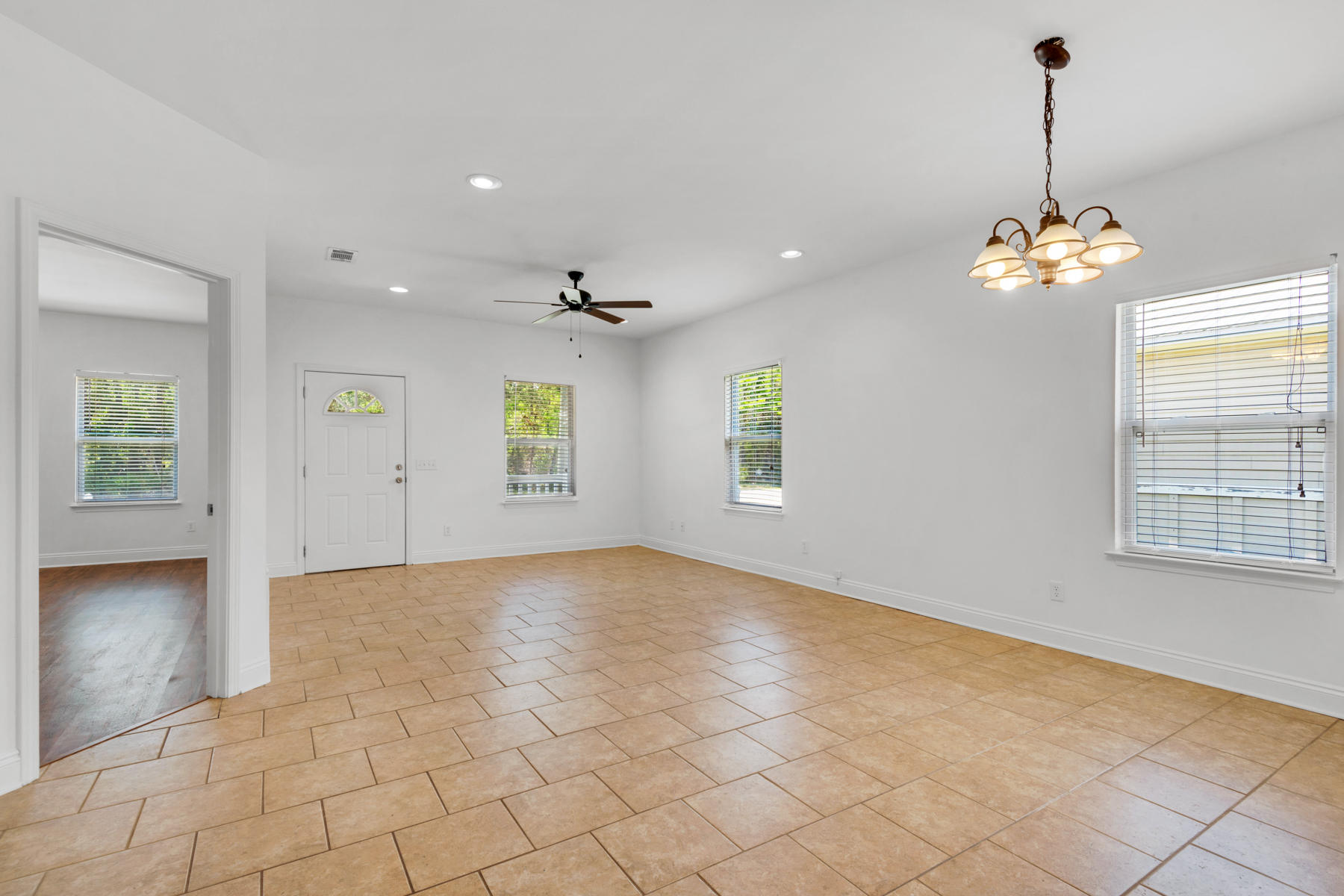 249 County Line Road Niceville, FL 32578 - Photo 2 of 17 a view of an empty room with window and chandelier