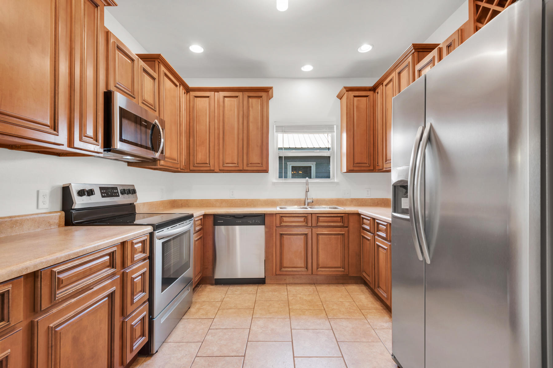 249 County Line Road Niceville, FL 32578 - Photo 3 of 17 a kitchen with stainless steel appliances granite countertop a refrigerator and a stove top oven