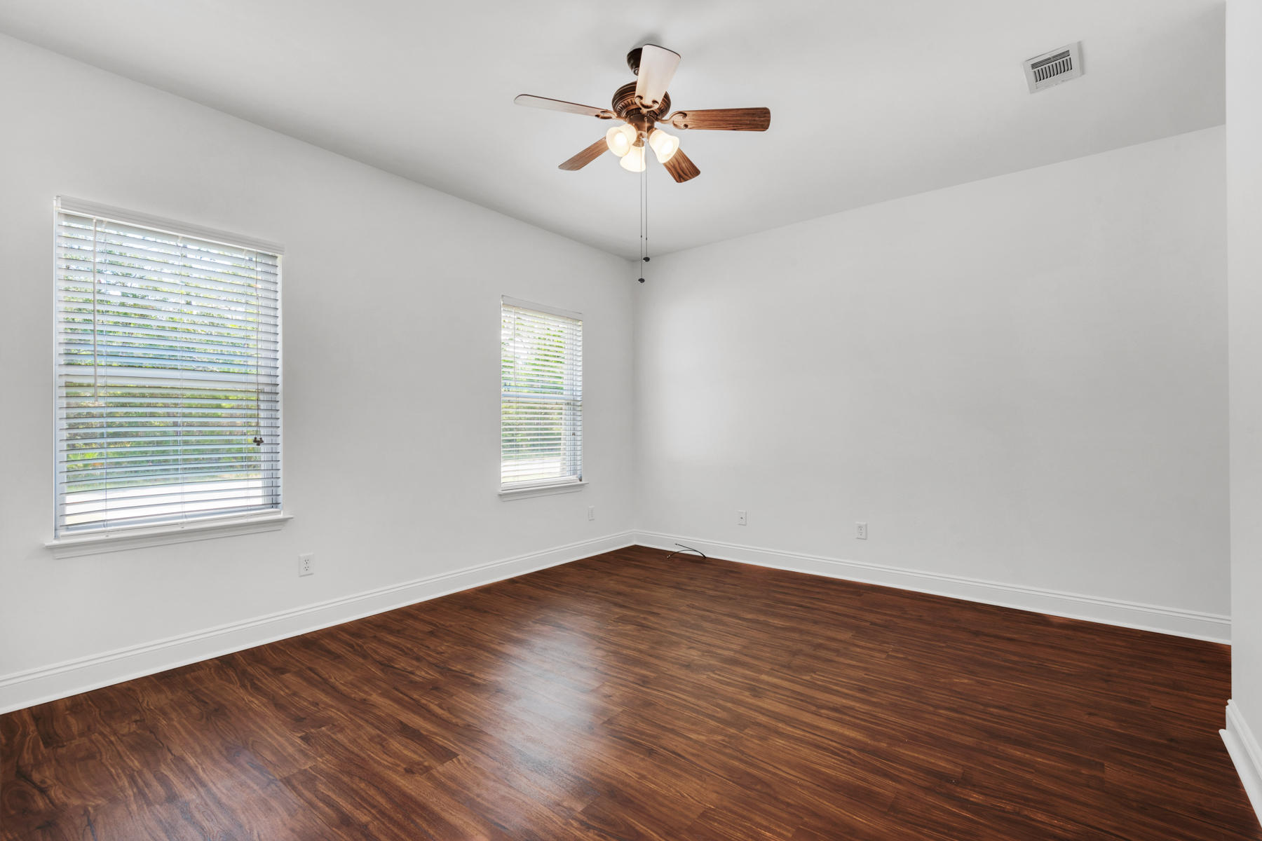 249 County Line Road Niceville, FL 32578 - Photo 8 of 17 a view of a room with wooden floor and chandelier fan