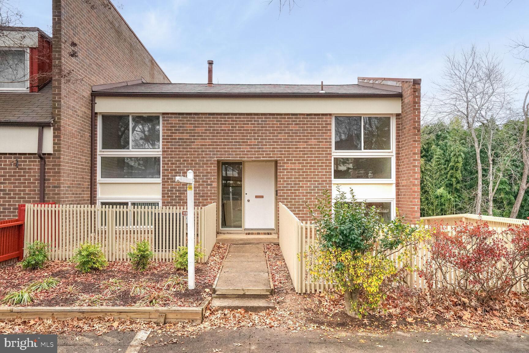 11350 Links Drive Reston, VA 20190 - Photo 1 of 22 a front view of a house with garden
