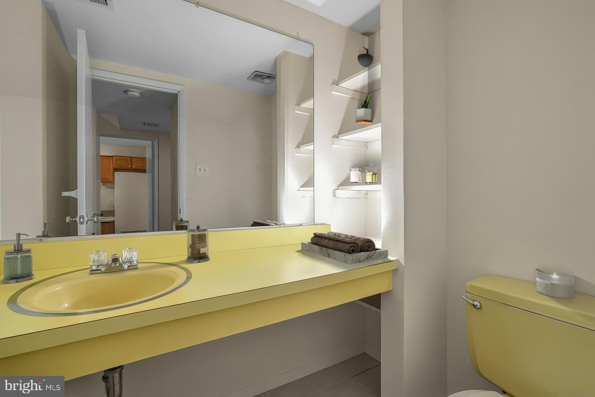 11350 Links Drive Reston, VA 20190 - Photo 18 of 22 a bathroom with a granite countertop sink and a mirror