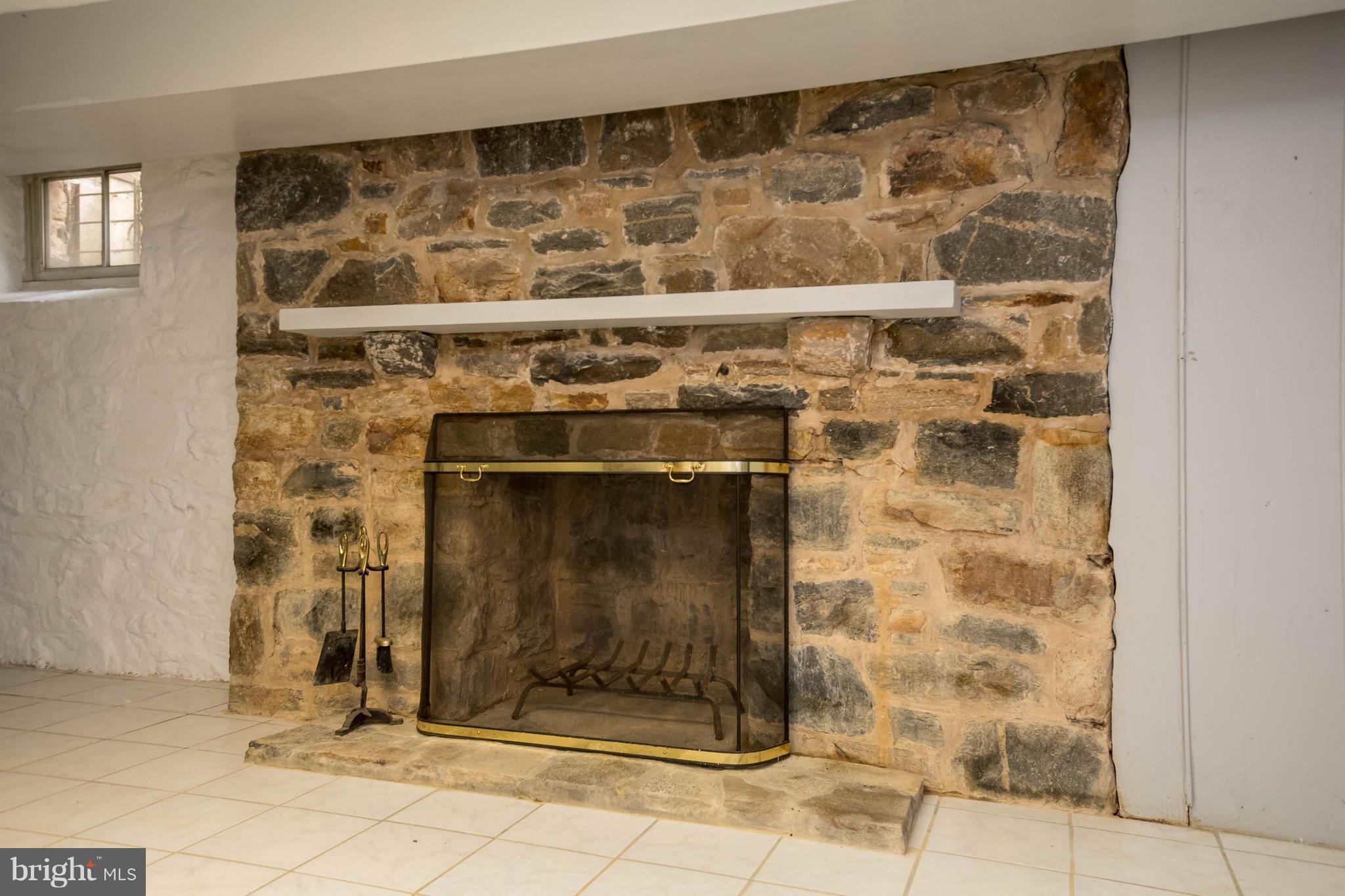 4129 Westview Road Baltimore, MD 21218 - Photo 27 of 30 PARTIALLY FINISHED STONE WOOD BURNING FIREPLACE