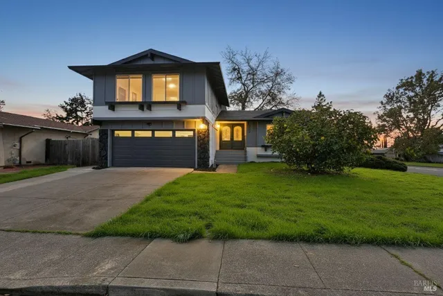 a front view of a house with a yard