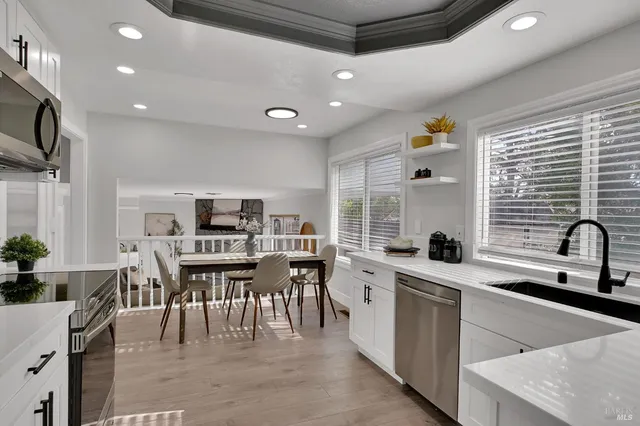 a kitchen with a sink cabinets and window