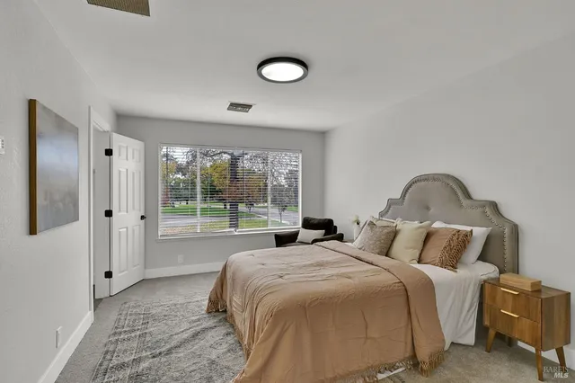 a bathroom with a double vanity sink and mirror