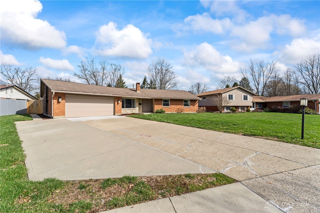 2247 East Whipp Road Dayton, OH 45440 - Photo 6 of 52 This charming residence features a well-maintained exterior and a spacious driveway, offering comfortable suburban living.