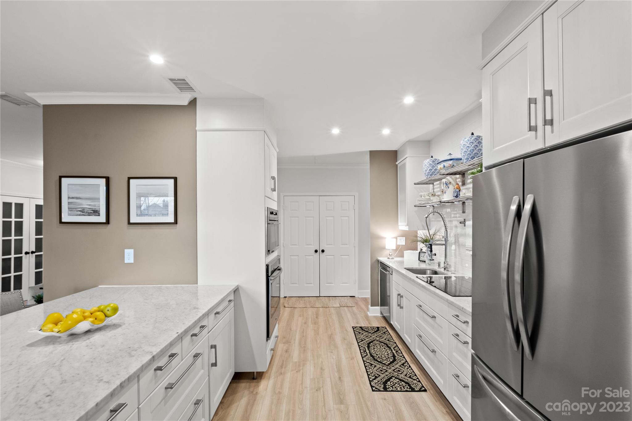 912 Cherokee Road Charlotte, NC 28207 - Photo 15 of 32 a kitchen with stainless steel appliances granite countertop a refrigerator and a stove top oven