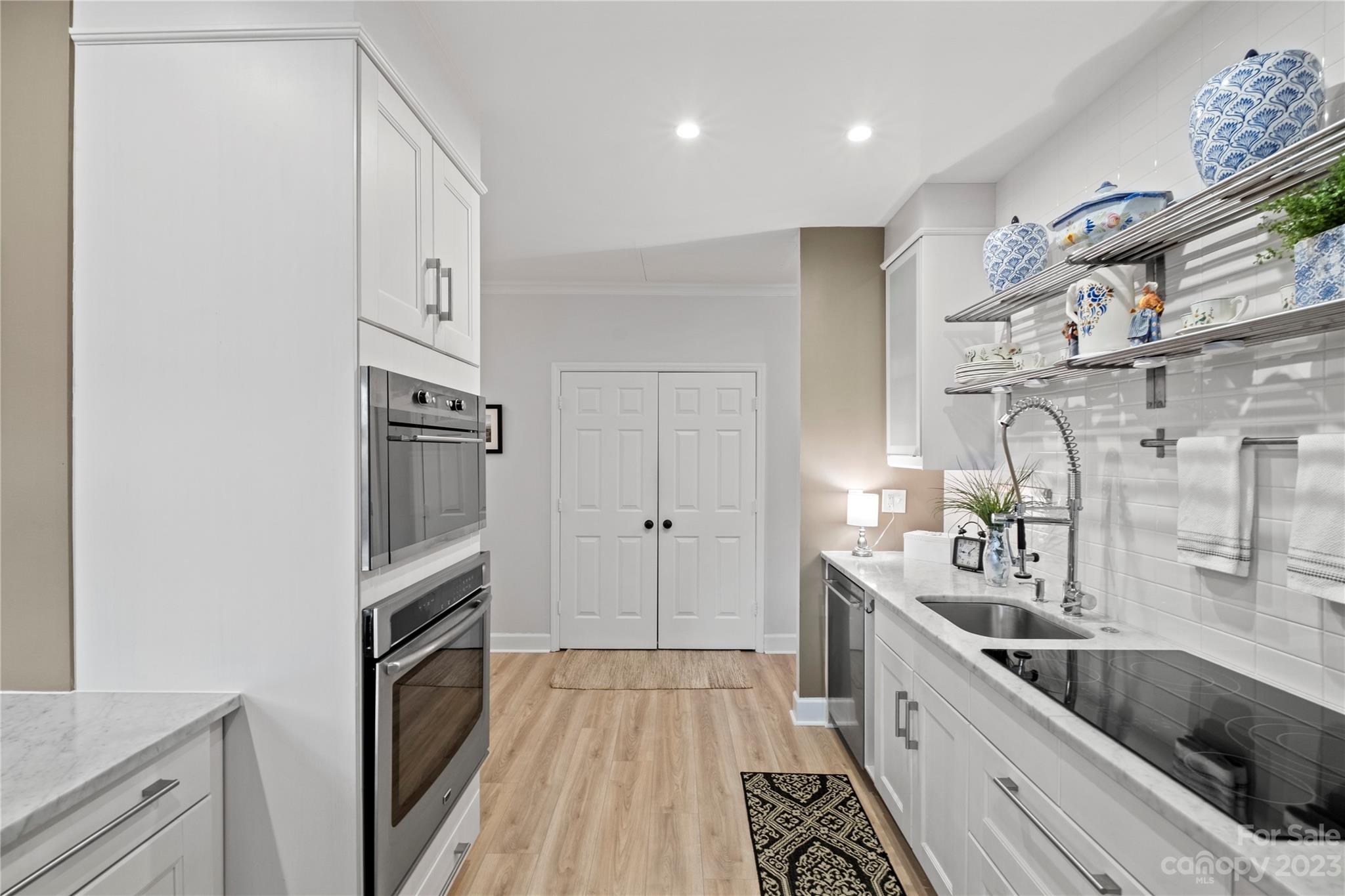 912 Cherokee Road Charlotte, NC 28207 - Photo 17 of 32 a kitchen with granite countertop a sink and a stove top oven
