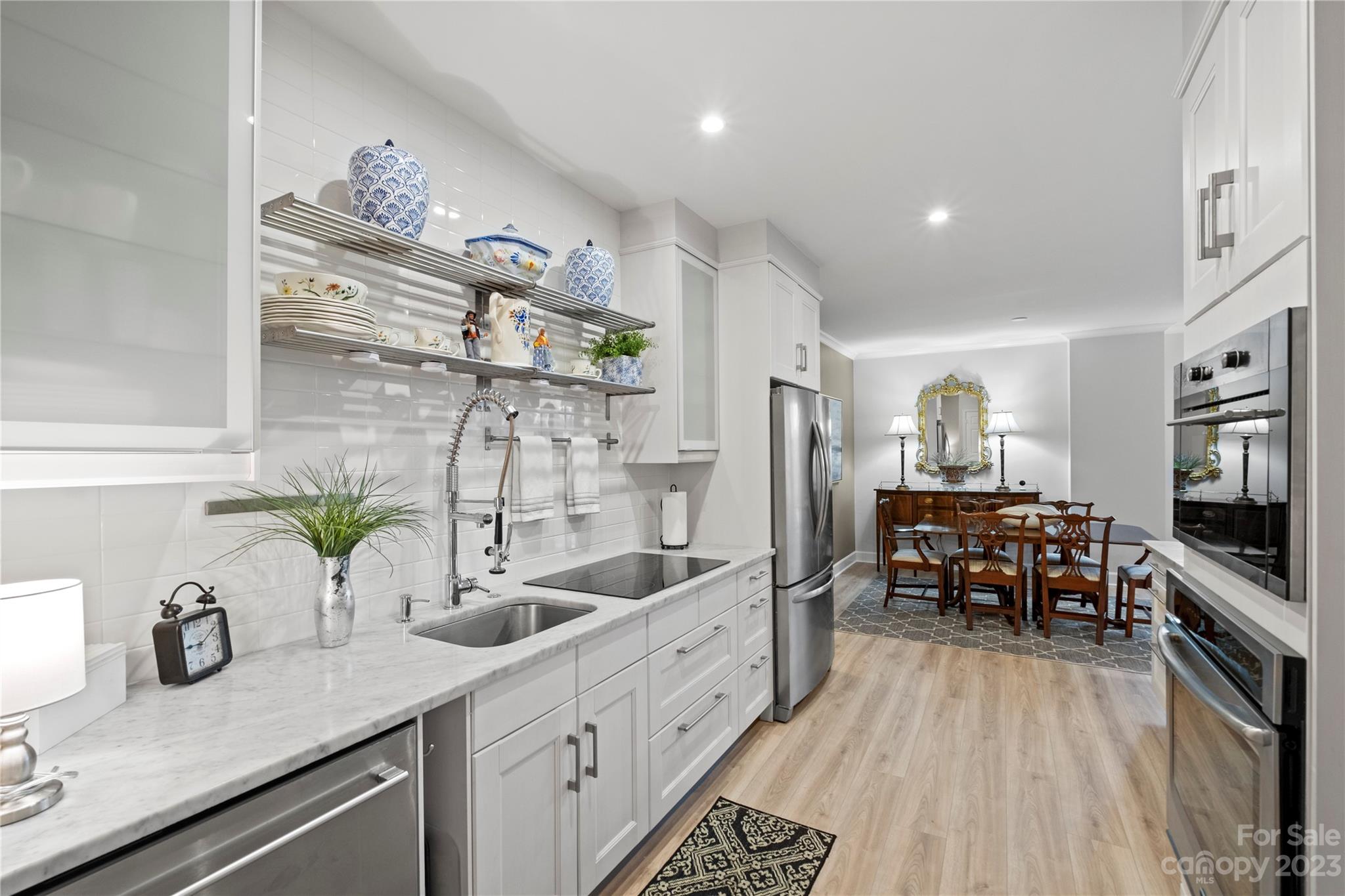 912 Cherokee Road Charlotte, NC 28207 - Photo 19 of 32 a kitchen with sink cabinets and counter space