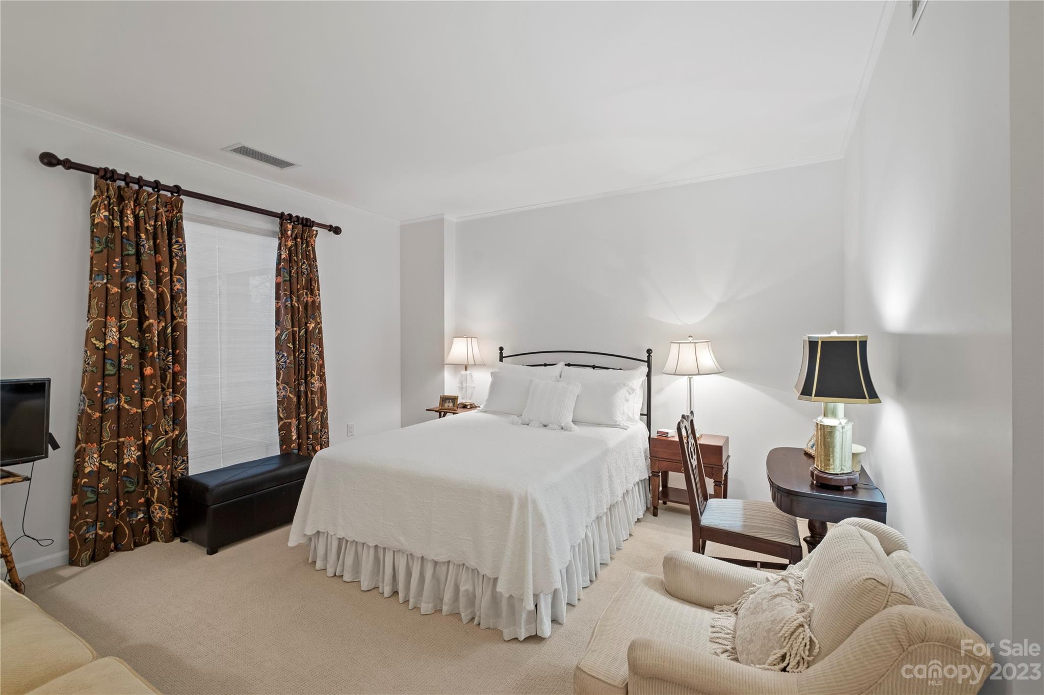 912 Cherokee Road Charlotte, NC 28207 - Photo 21 of 32 a bedroom with a bed and window