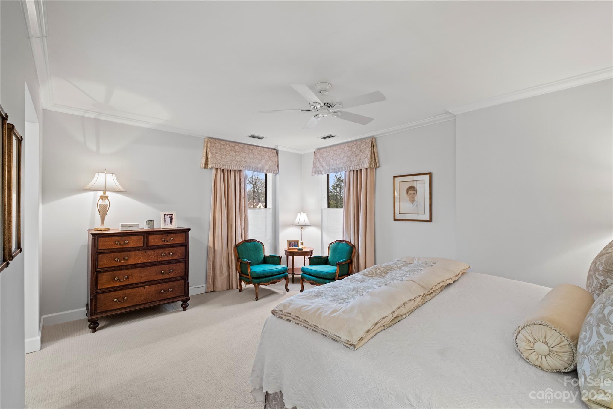 912 Cherokee Road Charlotte, NC 28207 - Photo 24 of 32 a bedroom with a bed and a dresser