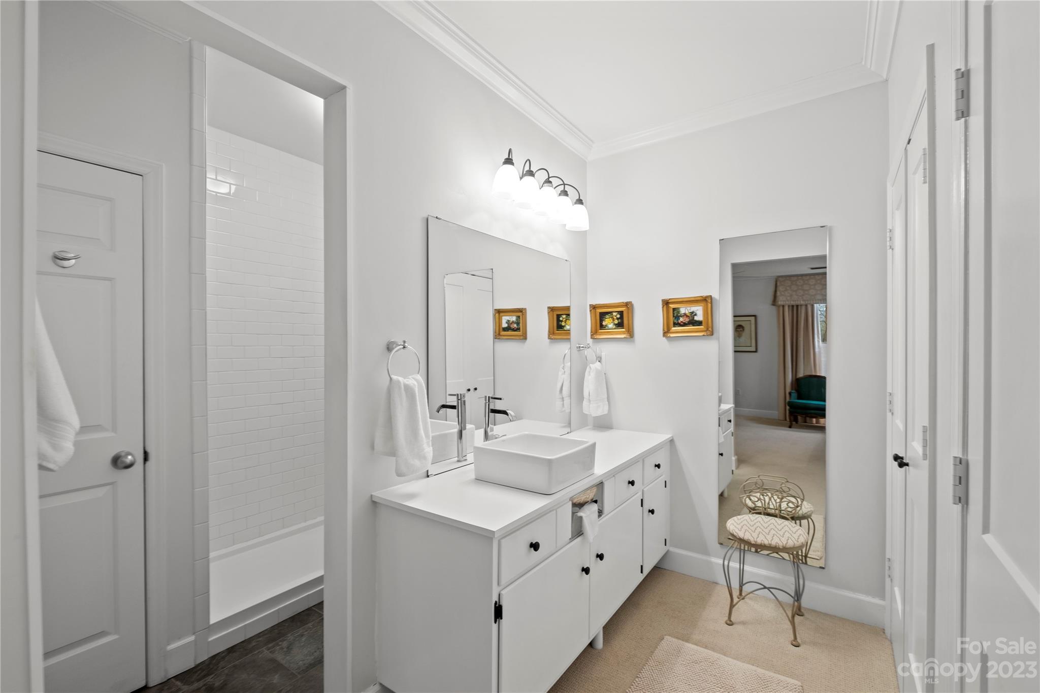 912 Cherokee Road Charlotte, NC 28207 - Photo 27 of 32 a bathroom with a double vanity sink mirror and toilet