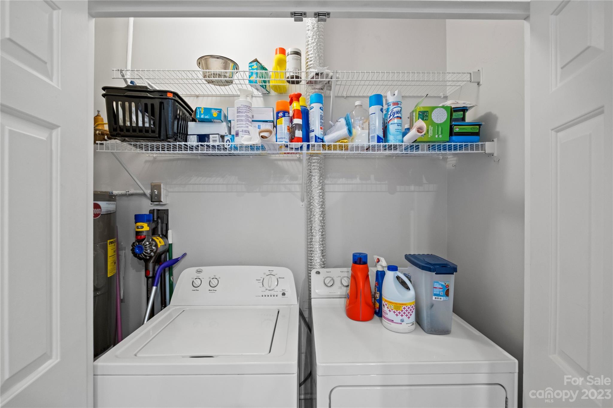 912 Cherokee Road Charlotte, NC 28207 - Photo 29 of 32 a utility room with lots of clutter and storage