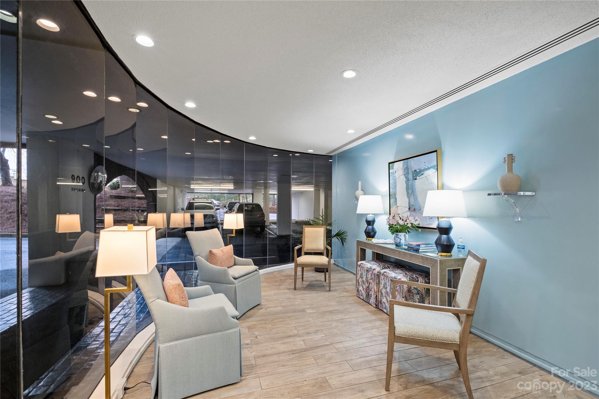 912 Cherokee Road Charlotte, NC 28207 - Photo 4 of 32 a living room with furniture and a lamp