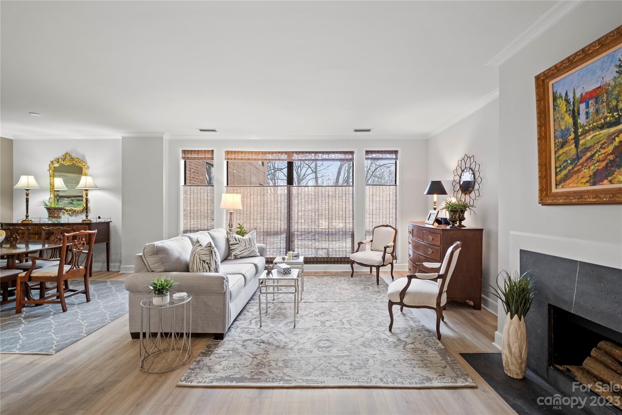912 Cherokee Road Charlotte, NC 28207 - Photo 9 of 32 a living room with furniture and a large window