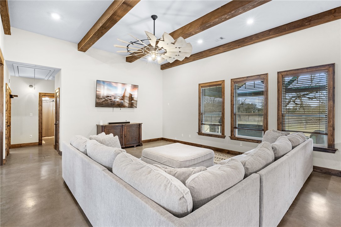 7440 Fm 39 Road South North Zulch, TX 77872 - Photo 13 of 50 a living room with furniture or chandelier and a large window