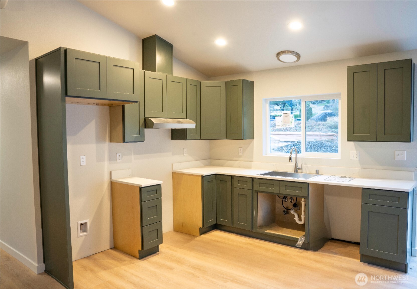 2923 Brook Lane Sedro-Woolley, WA 98284 - Photo 7 of 10 a kitchen with stainless steel appliances granite countertop a sink stove and refrigerator