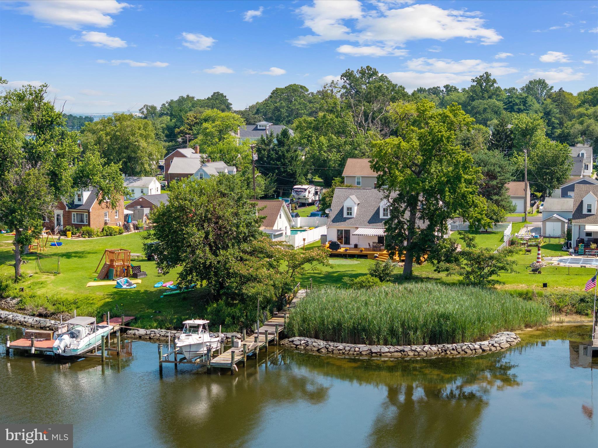 a view of a lake with houses swimming pool and outdoor space