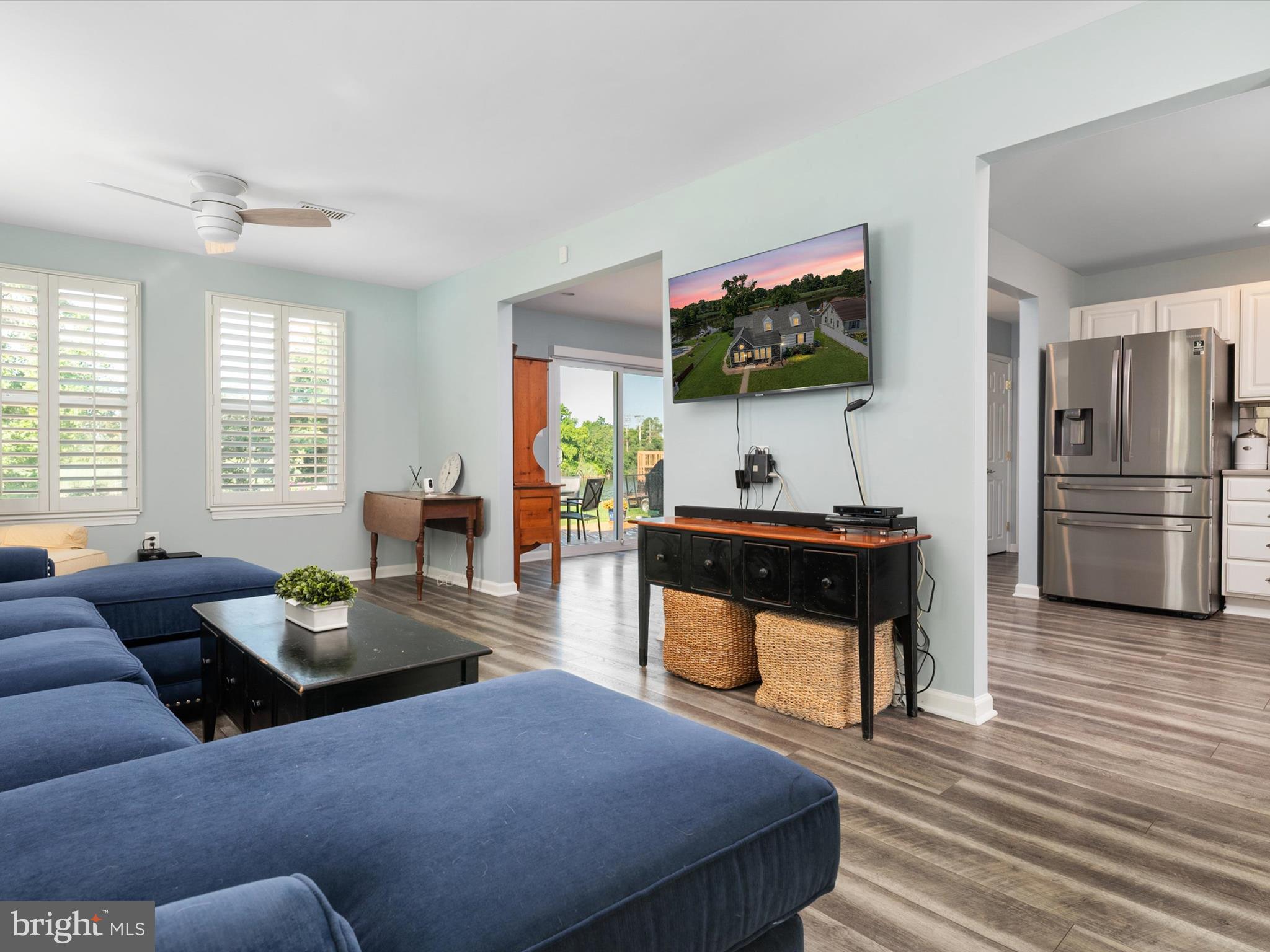 8426 Park Road Pasadena, MD 21122 - Photo 11 of 59 a living room with furniture and a flat screen tv