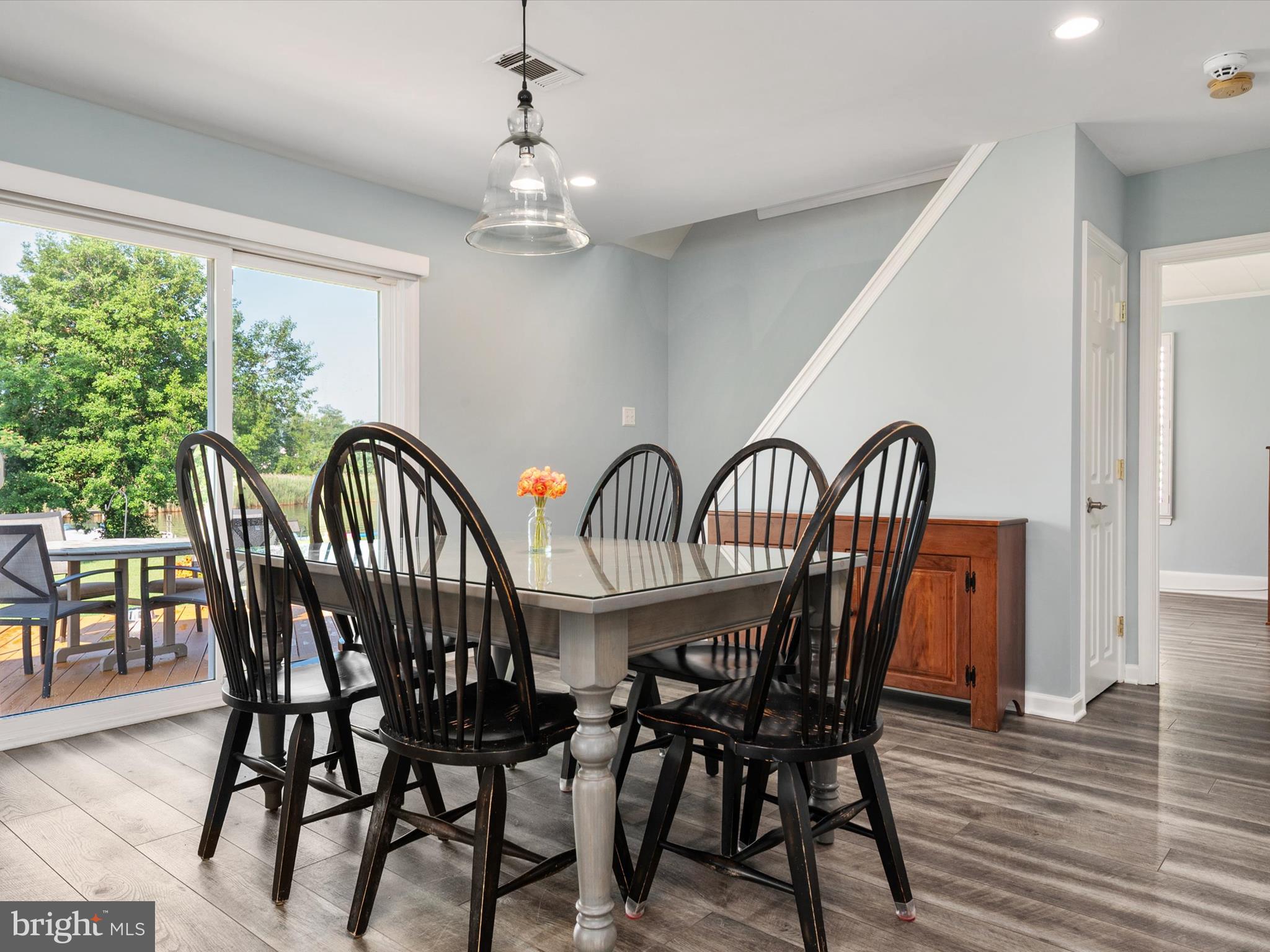 8426 Park Road Pasadena, MD 21122 - Photo 14 of 59 a view of a dining room with furniture window and wooden floor