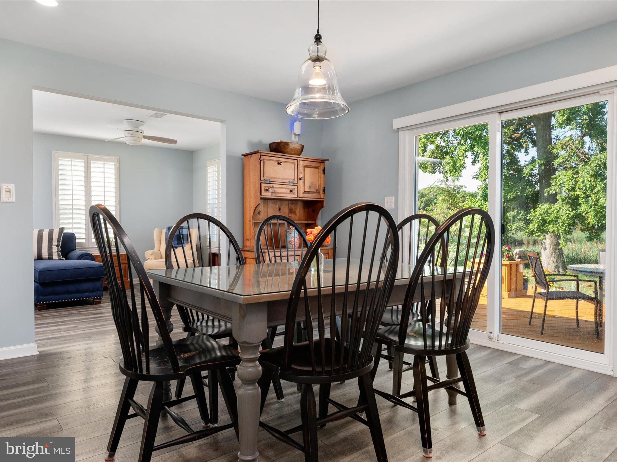 8426 Park Road Pasadena, MD 21122 - Photo 15 of 59 a view of a dining room with furniture window and wooden floor