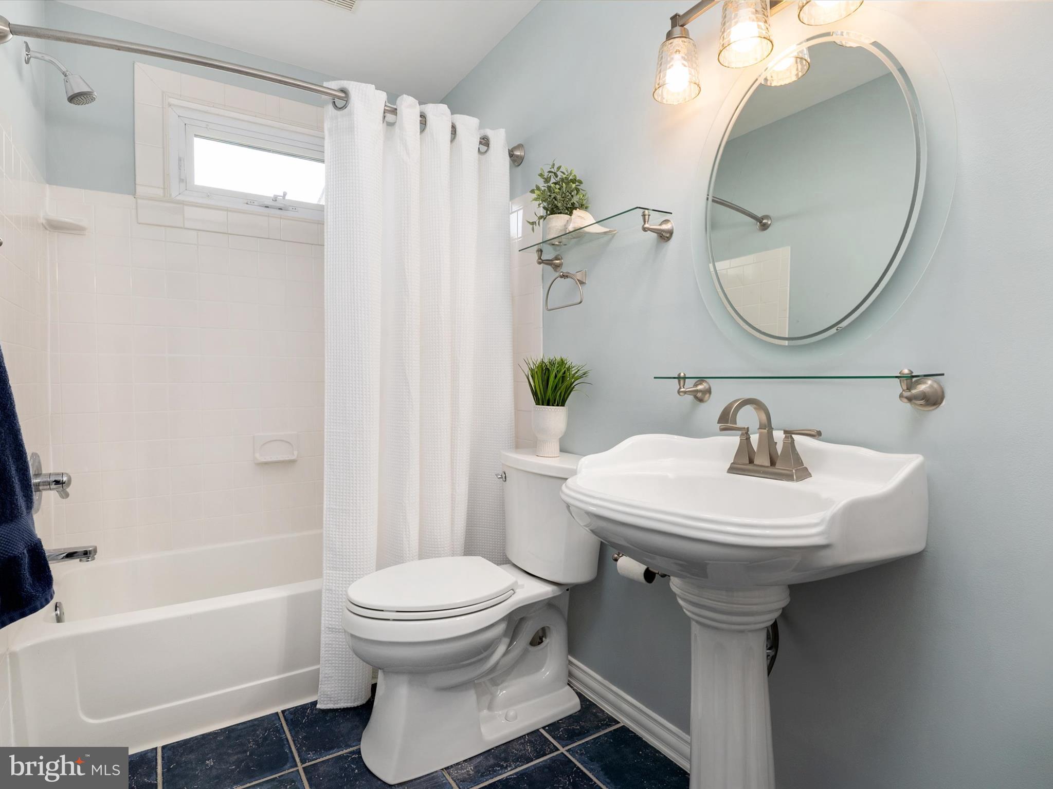 8426 Park Road Pasadena, MD 21122 - Photo 18 of 59 a bathroom with a sink toilet and shower