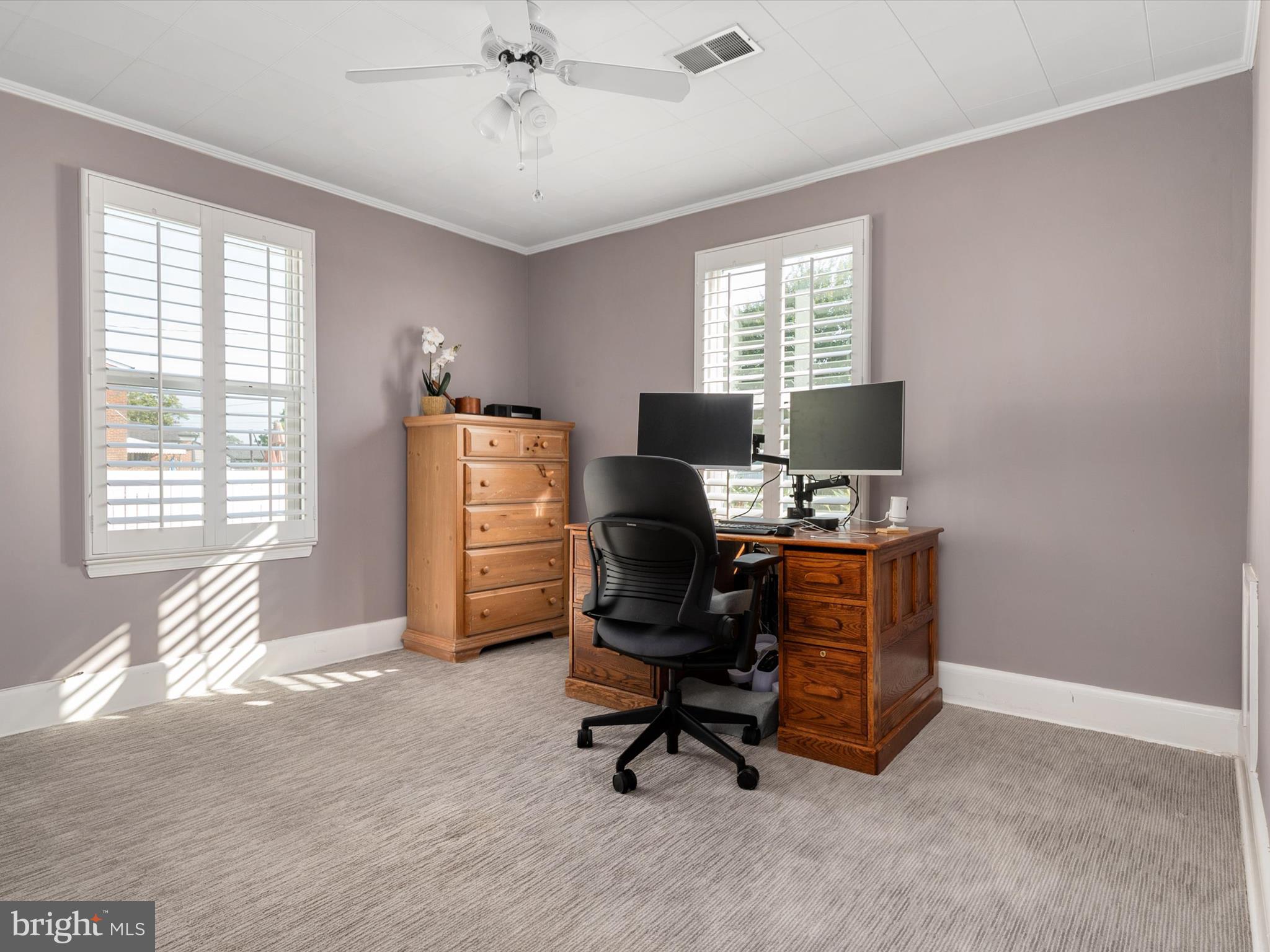 8426 Park Road Pasadena, MD 21122 - Photo 19 of 59 a view of a workspace with furniture and a window
