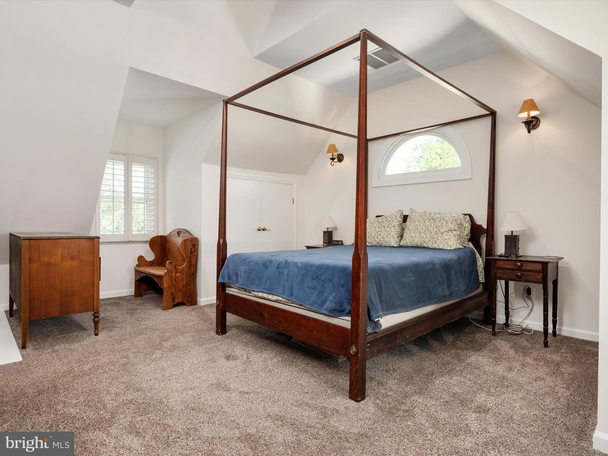 8426 Park Road Pasadena, MD 21122 - Photo 21 of 59 a bedroom with a bed and a mirror next to a window