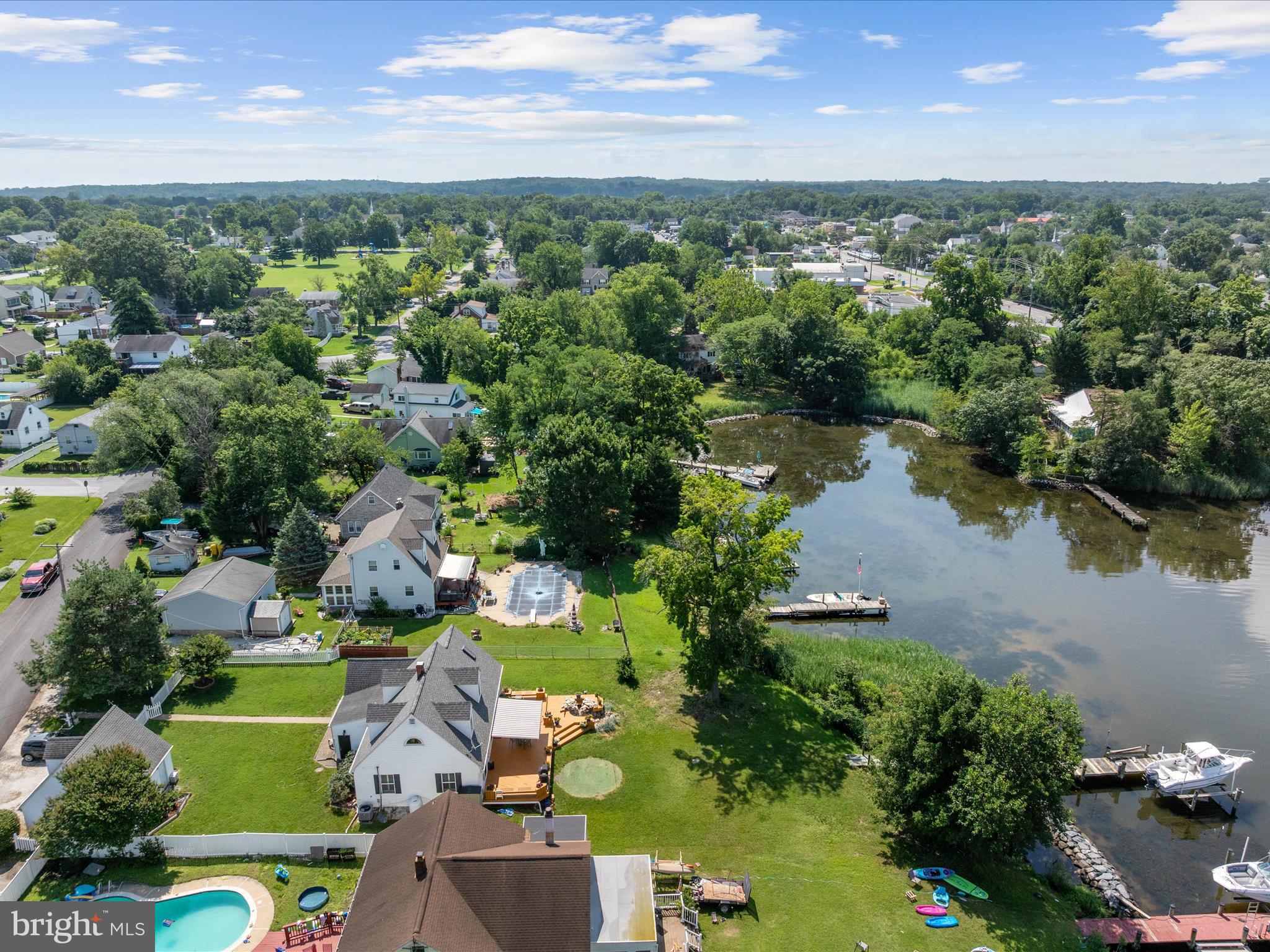 8426 Park Road Pasadena, MD 21122 - Photo 43 of 59 an aerial view of a houses with a yard and lake view