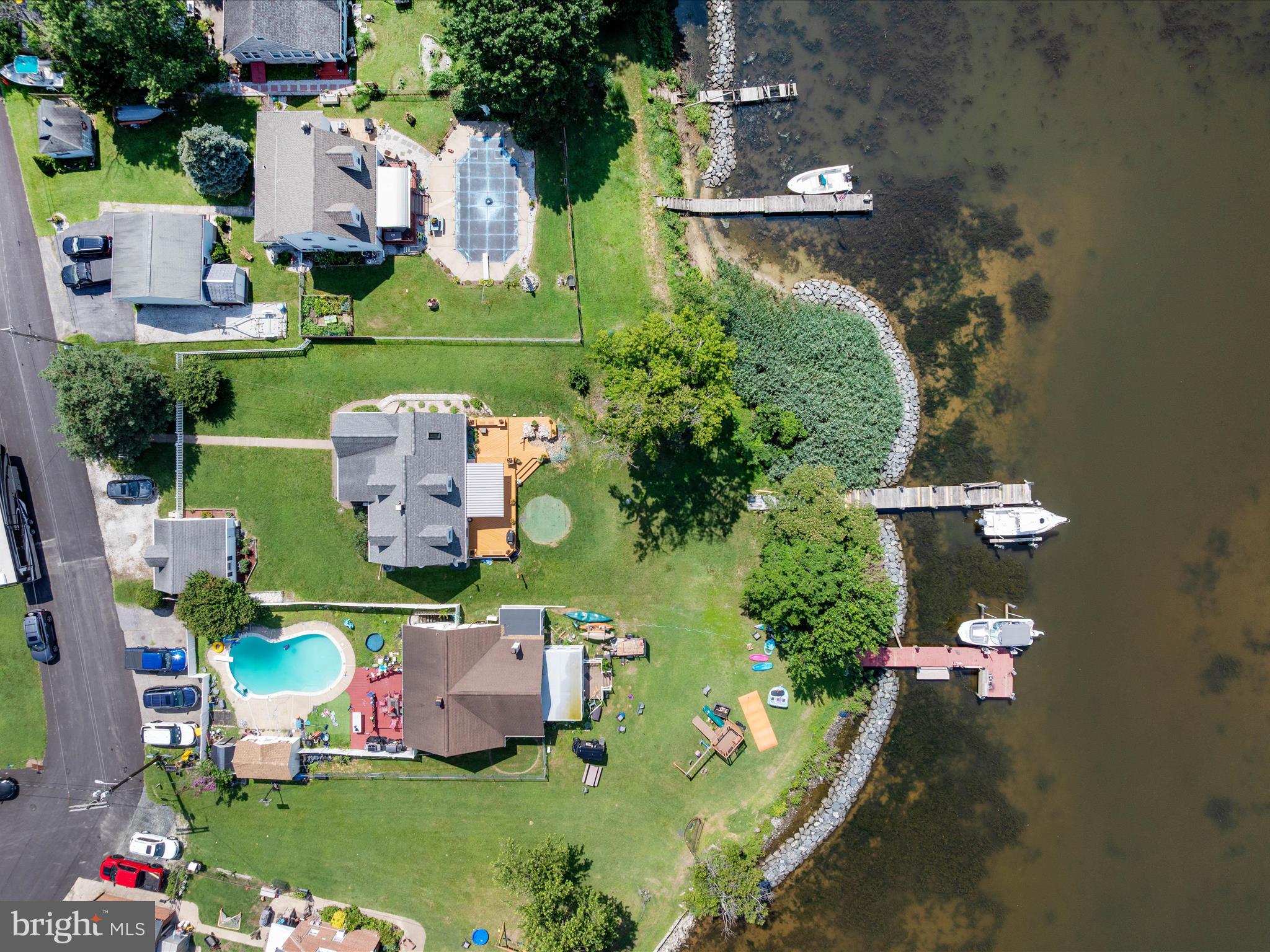8426 Park Road Pasadena, MD 21122 - Photo 44 of 59 an aerial view of a house with a garden and trees