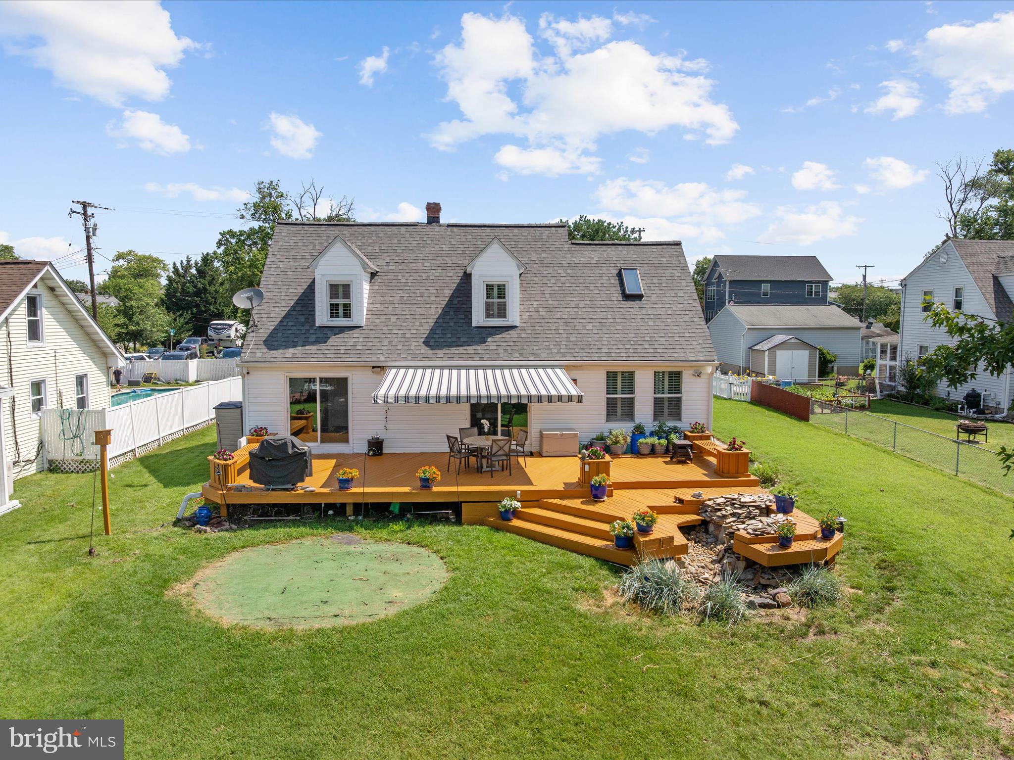 8426 Park Road Pasadena, MD 21122 - Photo 46 of 59 an aerial view of a house with swimming pool and a yard