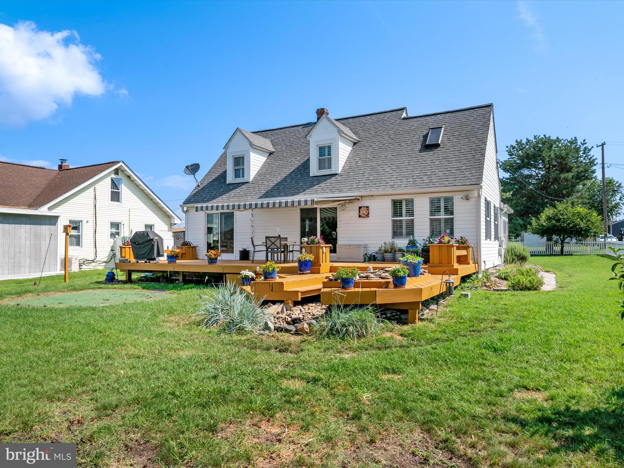8426 Park Road Pasadena, MD 21122 - Photo 54 of 59 a view of a house with backyard sitting area and garden