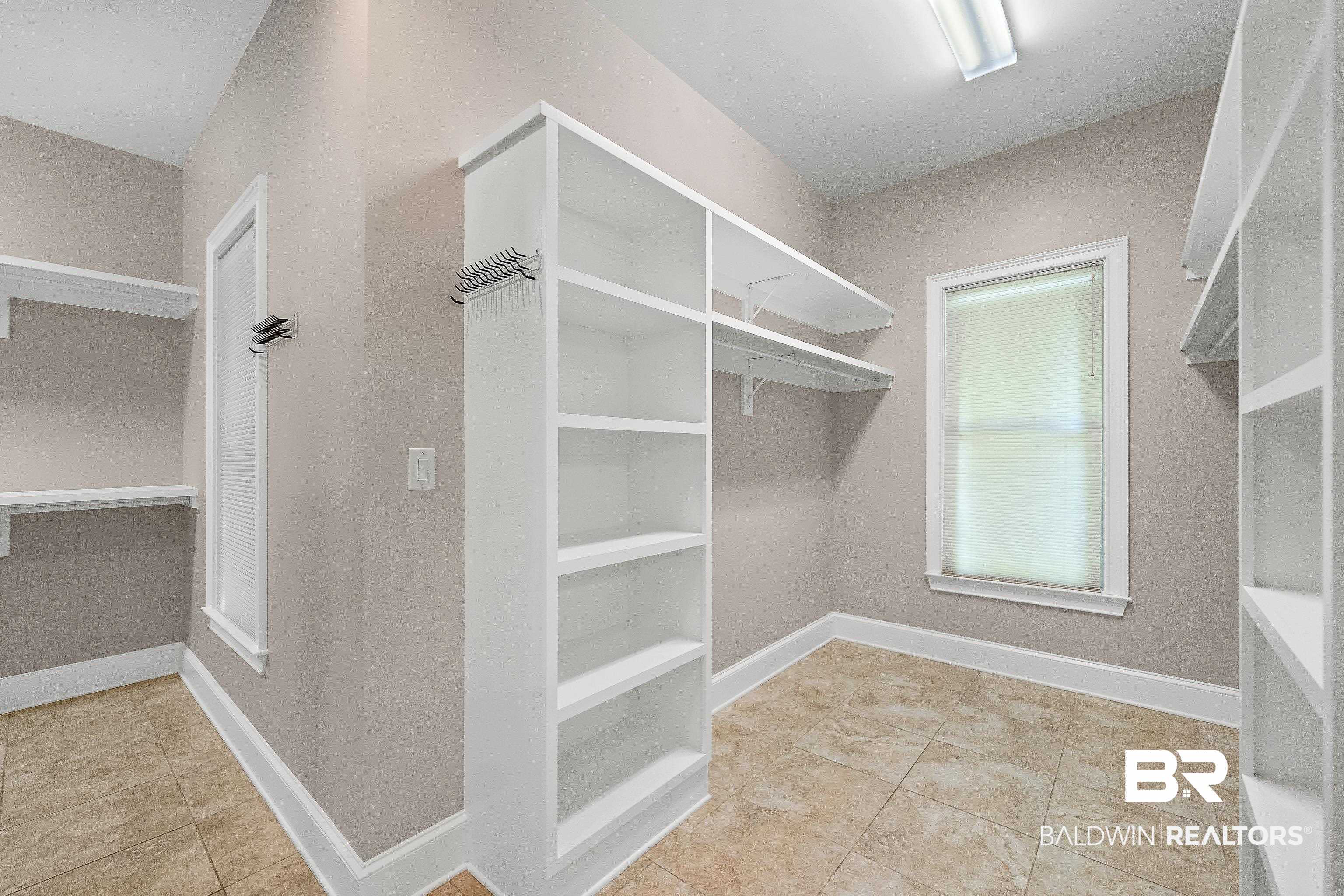 17663 Burwick Loop Fairhope, AL 36532 - Photo 29 of 41 Spacious closet with light tile patterned floors