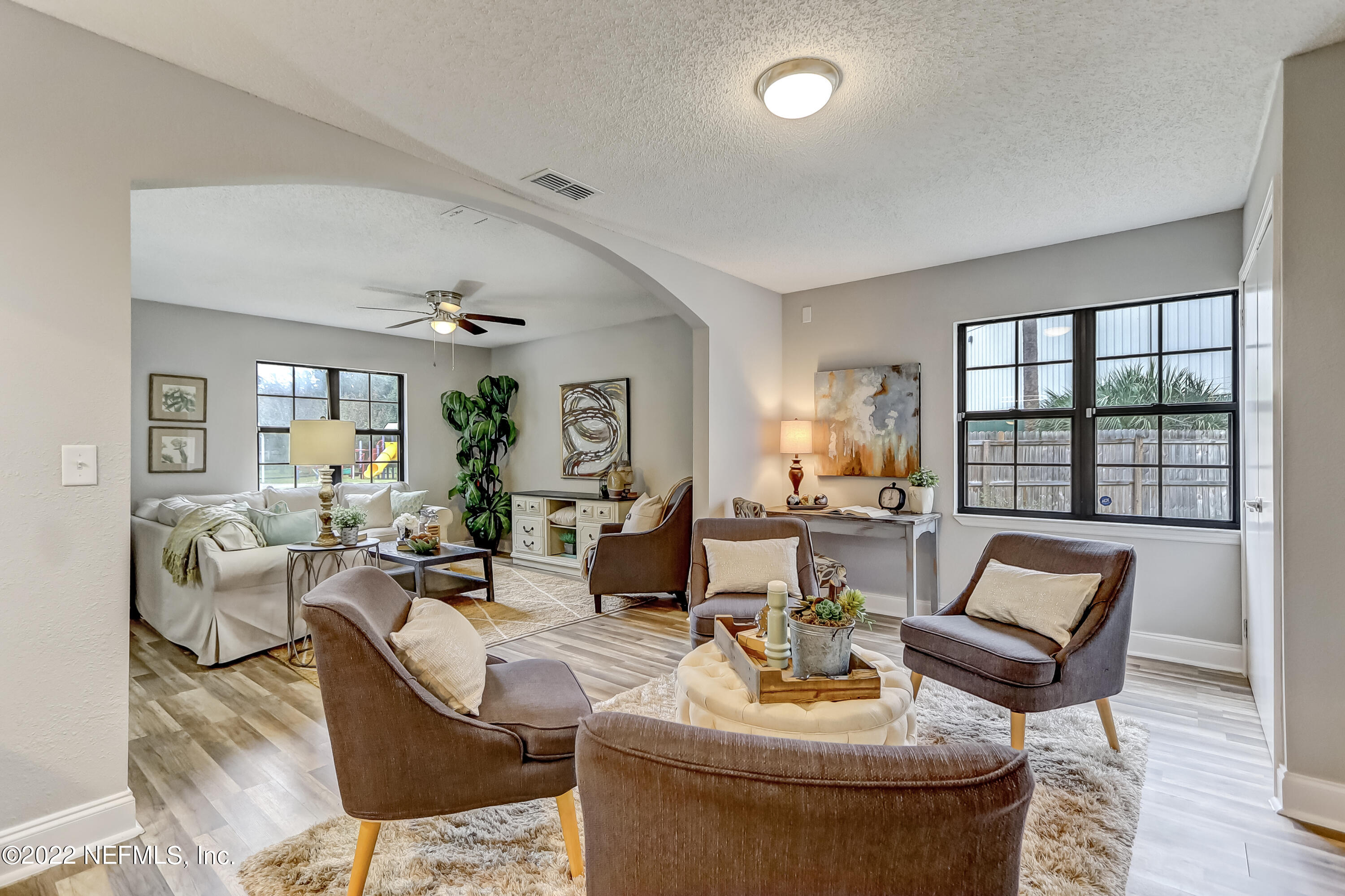 3607 Basil Road Jacksonville, FL 32207 - Photo 11 of 31 a living room with fireplace furniture and a large window