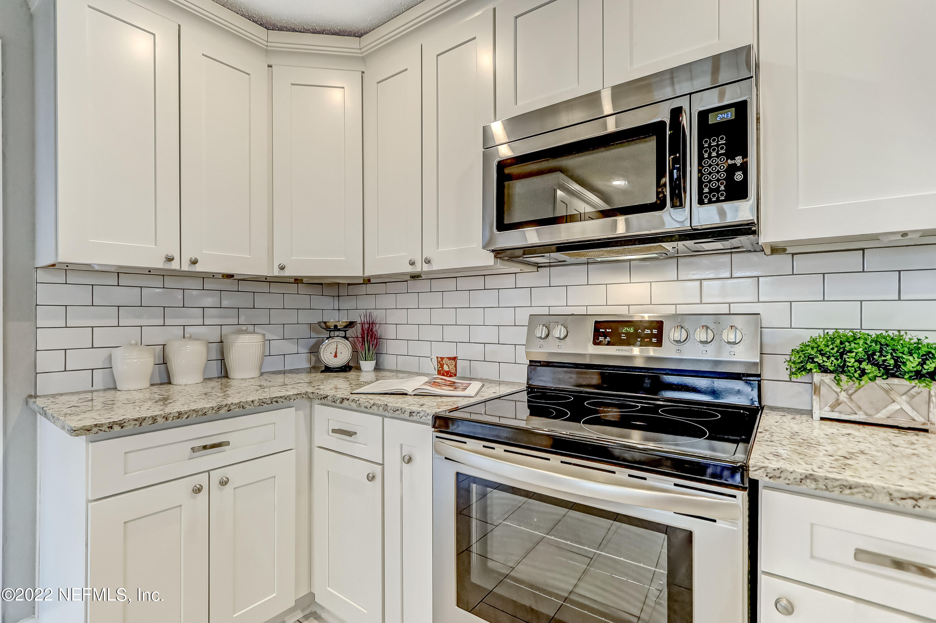 3607 Basil Road Jacksonville, FL 32207 - Photo 14 of 31 a kitchen with appliances a sink and cabinets