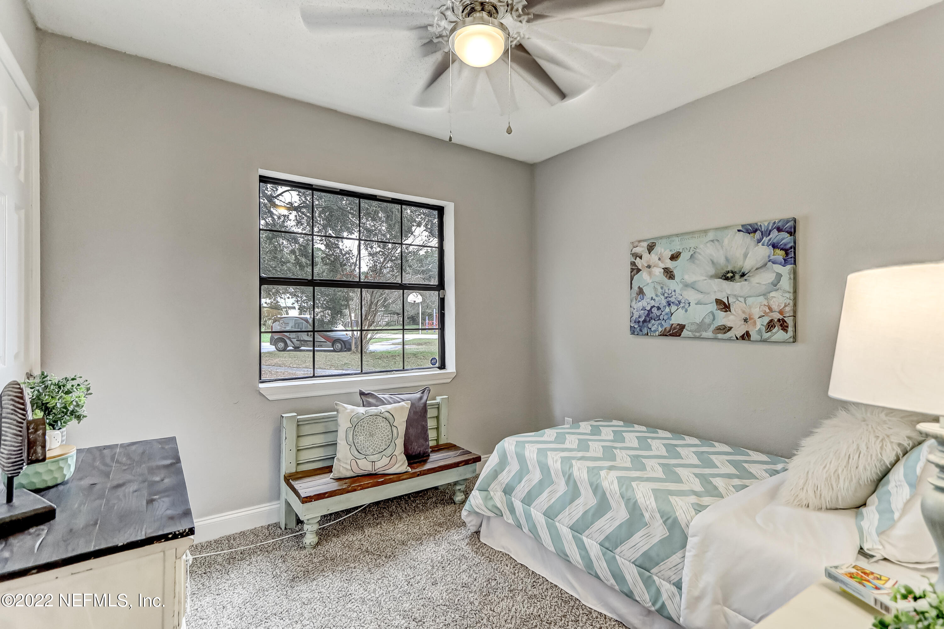 3607 Basil Road Jacksonville, FL 32207 - Photo 20 of 31 a bedroom with a bed and a window