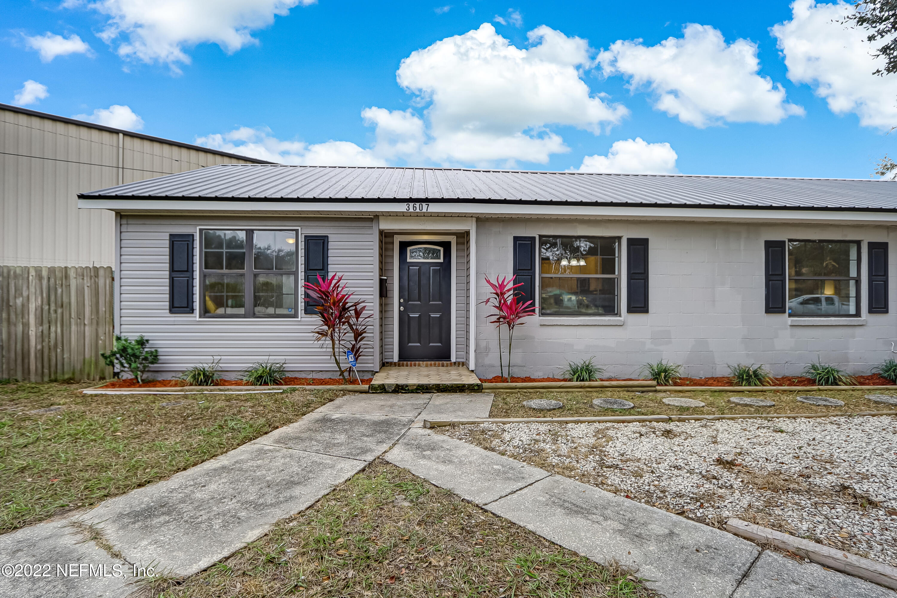 3607 Basil Road Jacksonville, FL 32207 - Photo 2 of 31 a view of a house with bunch of windows and plants