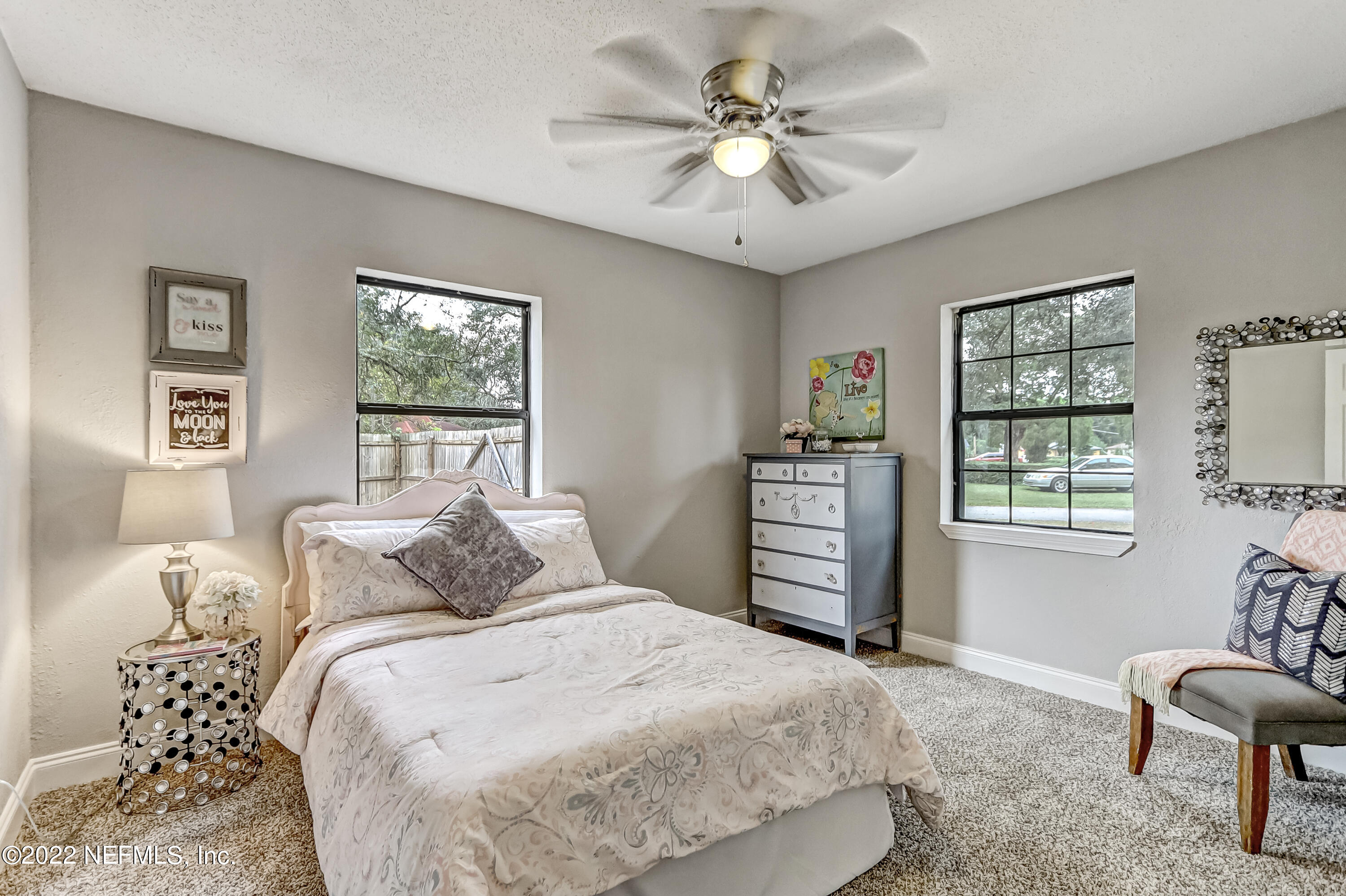 3607 Basil Road Jacksonville, FL 32207 - Photo 22 of 31 a bedroom with a large bed and a window