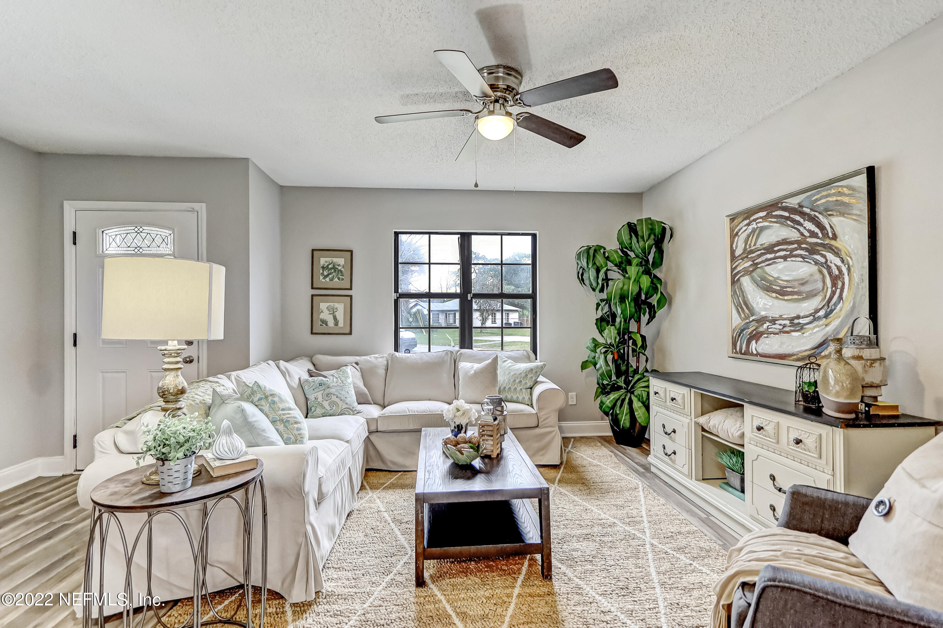 3607 Basil Road Jacksonville, FL 32207 - Photo 5 of 31 a living room with furniture and a window