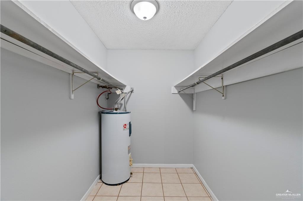 1701 West McIntyre Street, Unit 5 Edinburg, TX 78542 - Photo 13 of 15 Spacious closet featuring light tile patterned flooring and water heater