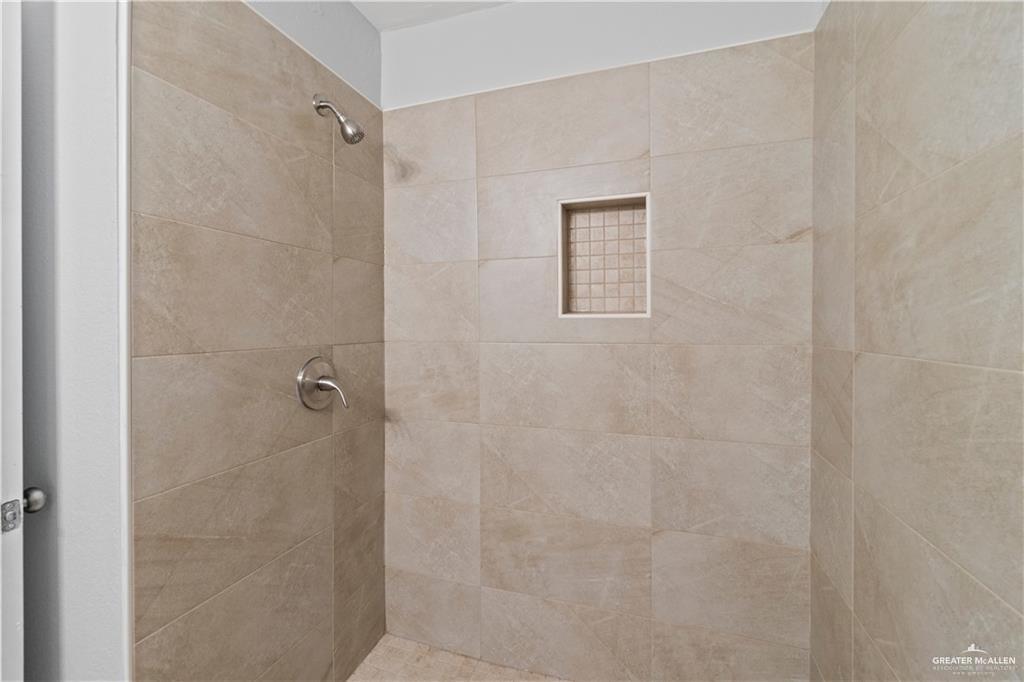 1701 West McIntyre Street, Unit 5 Edinburg, TX 78542 - Photo 10 of 15 Full bath with tiled shower