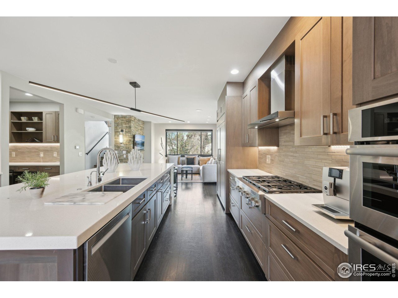 350 15th Street Boulder, CO 80302 - Photo 11 of 40 a kitchen with stainless steel appliances a sink stove and cabinets