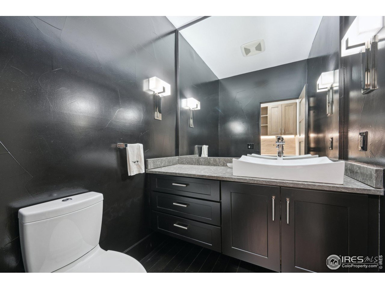 350 15th Street Boulder, CO 80302 - Photo 16 of 40 a bathroom with a sink a toilet and a mirror