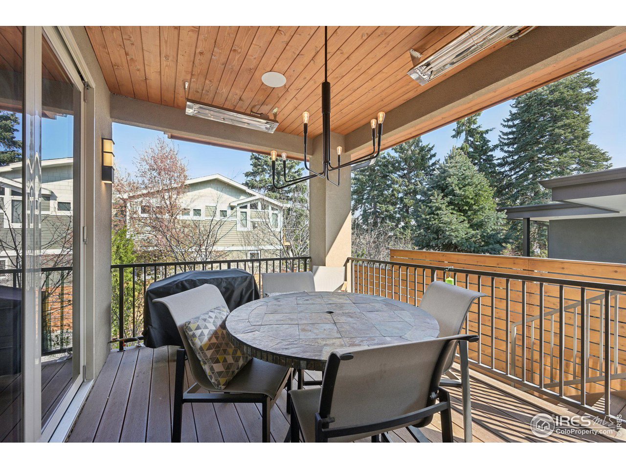 350 15th Street Boulder, CO 80302 - Photo 17 of 40 a view of a chairs and table on the deck